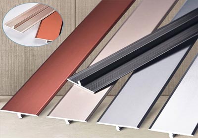 Close-up of transition trim and protective floor profile joining two flooring types