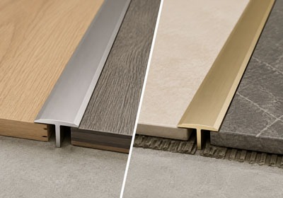 Silver and gold T-molding floor transition profiles.